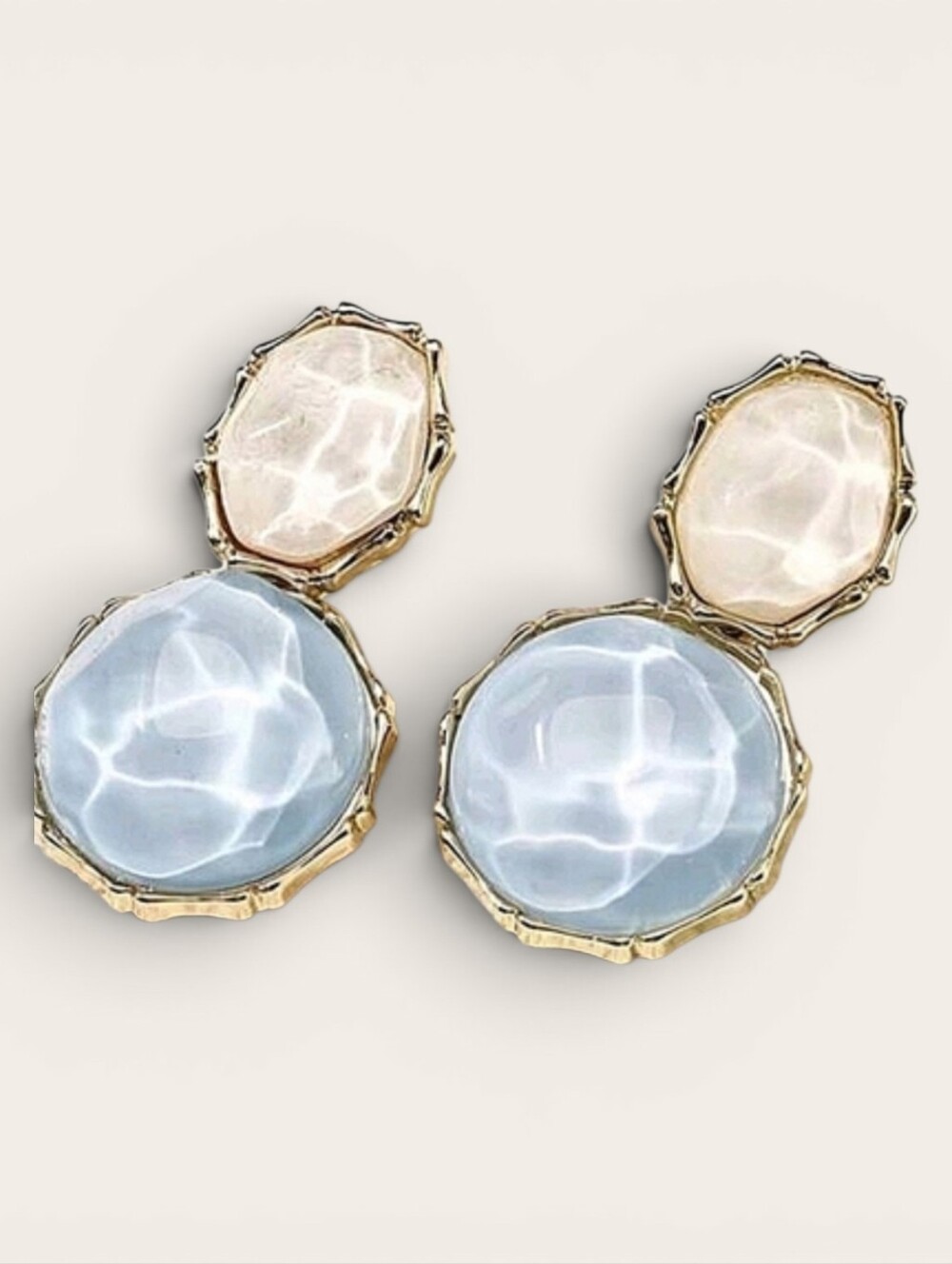 Light blue & white water wave pattern oval earrings; gold tone; 1.6h x .9w